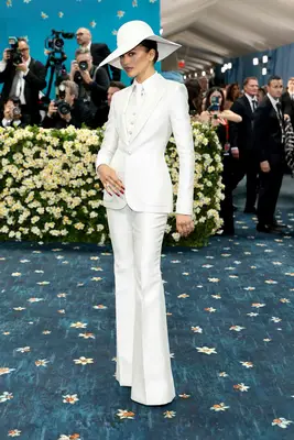 Zendaya wears a tailored white suit with floppy hat to the 2025 Met Gala