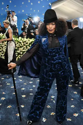 Angela Bassett wears a blue velvet suit with hat and cane to the 2025 Met Gala