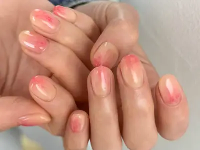 Dua Lipa shows off her rhinestone flower manicure in a selfie.