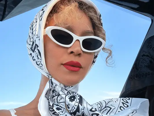 Beyonce wearing a headscarf