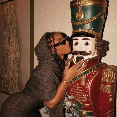 Chloe Bailey kissed a life-sized nutcracker with mismatched golden nails and a hooded gown