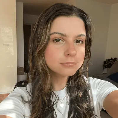 Selfie of a woman with long wet hair and glowing skin