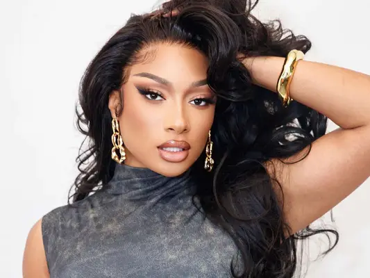 Megan thee stallion with gold jewelry 