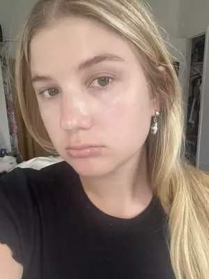 Woman with blonde hair and clean dewy skin