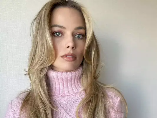 Margot Robbie in a vintage Versace sweater