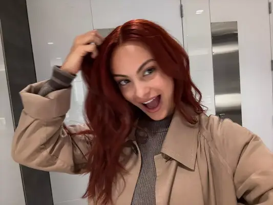 Camila Mendes with red hair. 
