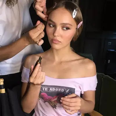 Lily-Rose Depp getting her makeup done