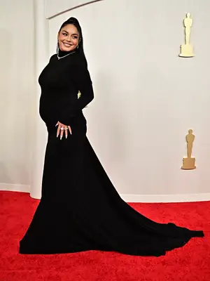 Vanessa Hudgens wears a black gown and debuts her pregnancy on the 2024 Oscars red carpet