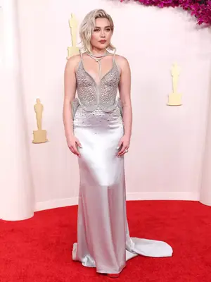 Florence Pugh wears a structured, bedazzled Del Core gown and Bulgari jewelry to the 2024 Oscars