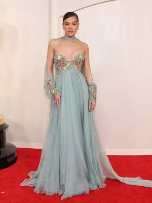 Hailee Steinfeld wears a powder blue gown with metallic gold detailing to the 2024 Oscars