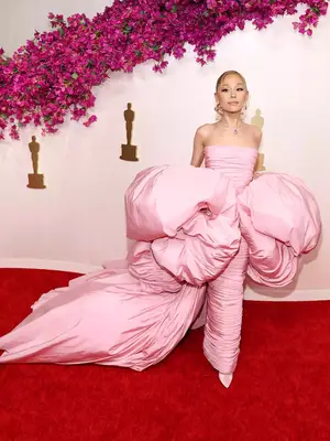 Ariana Grande wears a voluminous pink Giambattista Valli couture gown and Tiffany jewelry to the 2024 Oscars