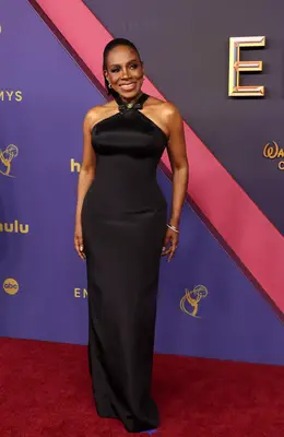 Sheryl Lee Ralph wears a sleek black gown with criss-cross neckline to the 2024 Emmy Awards
