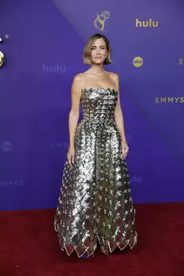 Kristen Wiig wears a textural metallic gown and sparkly jewelry to the 2024 Emmy Awards