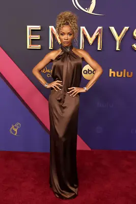 Zuri Hall wears a brown satin gown to the 2024 Emmy Awards