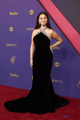 Selena Gomez wears a black gown with sparkly crossed halter neckline to the 2024 Emmy Awards