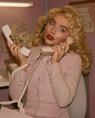 Sabrina Carpenter wearing her strawberry jelly lips.