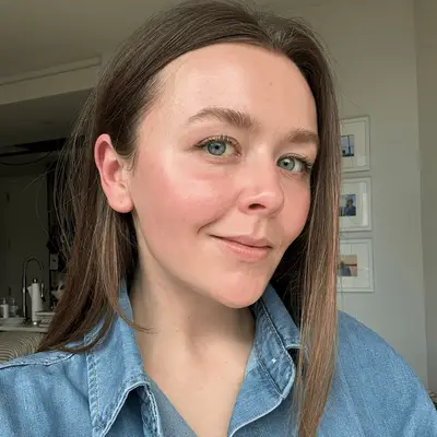 A close up of MYM Beauty Editorial Director Holly Rhue wearing e.l.f. SKIN