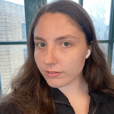 A close up of MYM Beauty associate Abby Dupes wearing e.l.f. SKIN Bronzing Drops.