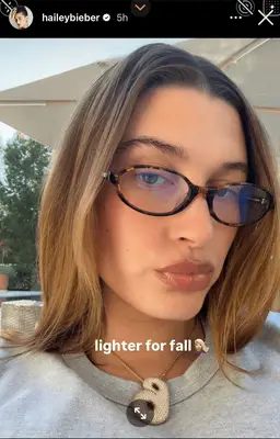 Hailey Bieber taking a selfie. 