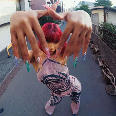 Megan Thee Stallion with butterfly nails. 