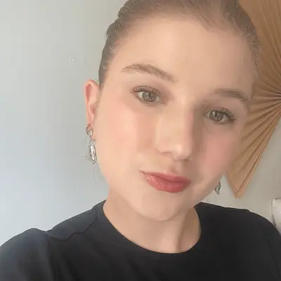 Bella wears Rare Beauty Soft Pinch Lip Oil 