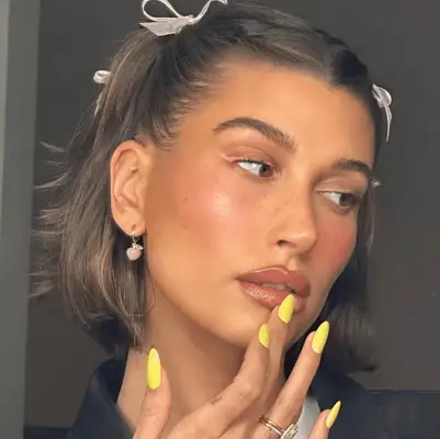 Hailey Bieber with bows in her hair 