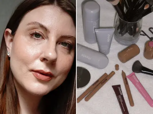 Selfie of a woman with glowy skin and subtle makeup next to an array of Rhode beauty products sitting on a towel