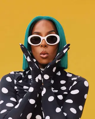 Kelly Rowland with a bright blue bob wig