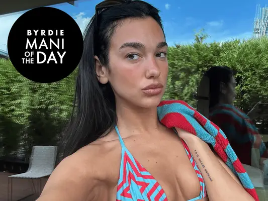 Dua Lipa in a blue and red bikini