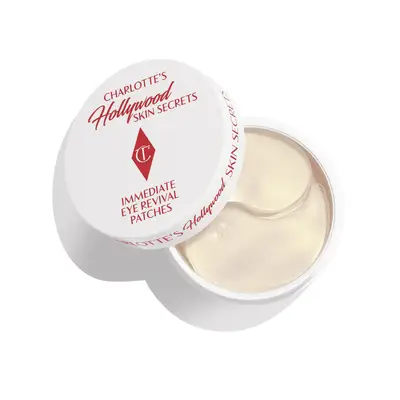 Charlotte Tilbury while and red under eye patch bottom with the lid slightly open