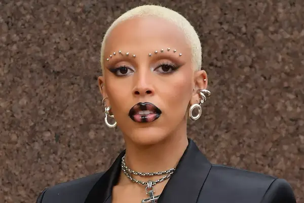 Doja Cat in black lipstick and studded eyebrows 