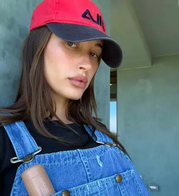Hailey Biber wearing overalls