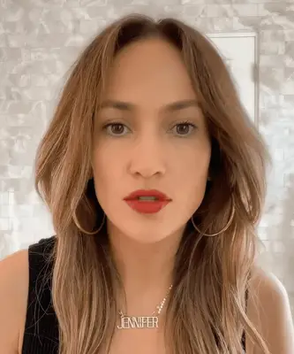 Jennifer Lopez with a glossy red lip look