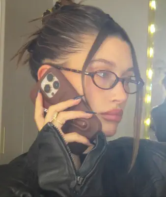 Hailey Bieber taking a selfie. 