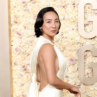 greta lee in wavy bob and white dress at golden globes