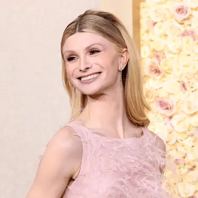 dylan mulvaney wearing light pink dress and eyeshadow to golden globes