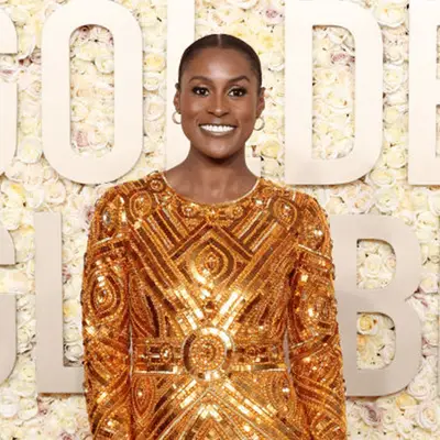 Issa rae in gold dress at golden globes