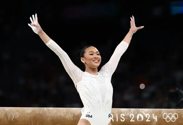 Sunisa Lee competing on balance beam.