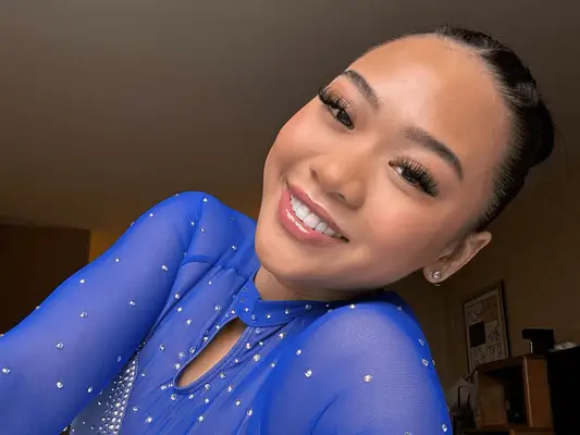 Suni Lee wearing a soft pink lip combo