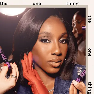 Ziwe wearing a smoky eye and denim jacket