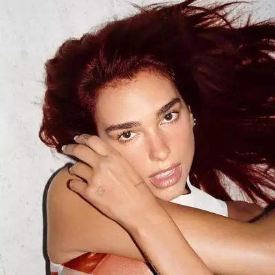 Dua Lipa with cherry cola hair