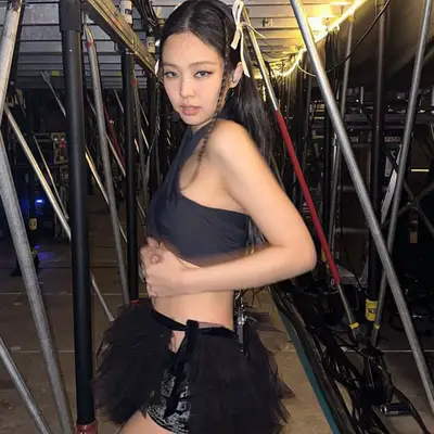 Jennie from black pink with a rhinestone nose strip on