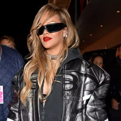 Rihanna with honey blonde hair and a biker outfit