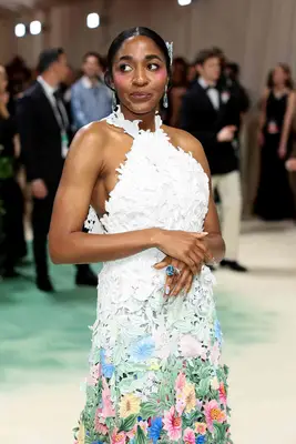 Ayo Edebiri at the 2024 Met Gala in a floral dress with bright pink blush