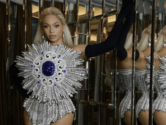BeyoncÃ¨ wearing a pearl-covered outfit and 