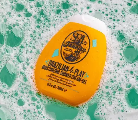 sol de janeiro shower cream gel floating in sudsy bathtub