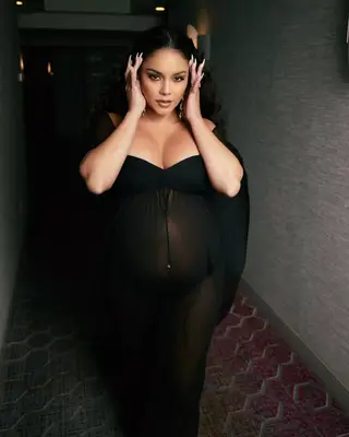 Vanessa Hudgens in long nails and mesh black dress showing off her pregnant belly