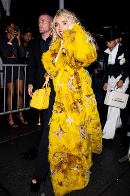 Sabrina Carpenter waves to fans while attending at Met Gala After Party.
