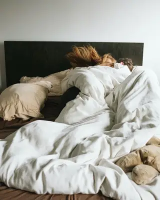 Couple laying in bed