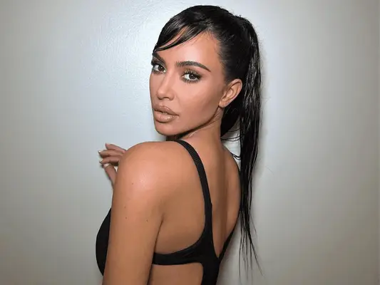 Kim Kardashian wearing jet black ponytail